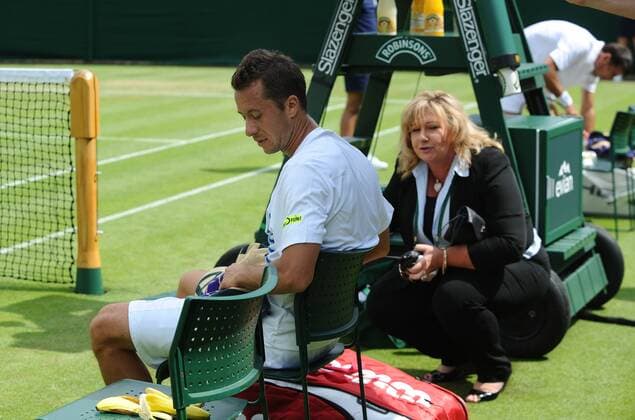 Tennis - 2013 Wimbledon Championships - Mens Singles First Round Philipp Kohlschreiber on Court 18. Philipp Kohlschreiber - Germany retires in the 5th set as the referee checks on him 