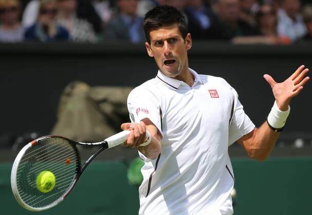 (130625) -- LONDON, June 25, 2013 (Xinhua) -- Novak Djokovic of Serbia returns a hit during the gentlemen s singles first round match on day 2 of the Wimbledon Lawn Tennis Championships at the All England Lawn Tennis and Croquet Club in London, Britain on June 25, 2013. (Xinhua Yin Gang) (SP)BRITAIN-LONDON-TENNIS-WIMBLEDON-DAY 2 