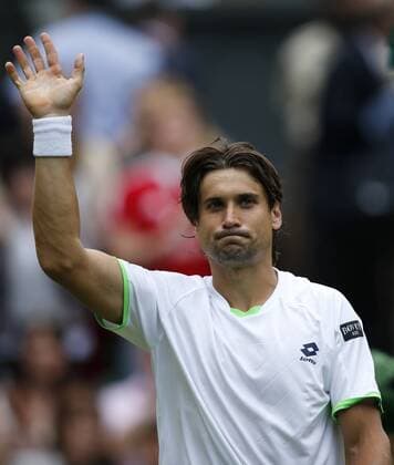 David Ferrer of Spain greets spectators after the first round of men s singles on day 2 of the Wimbledon Lawn Tennis Championships at the All England Lawn Tennis and Croquet Club in London, Britain, on June 25, 2013. 