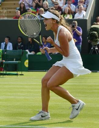 Tennis - 2013 Wimbledon Championships - Ladies Singles second Round on Court 2. Michelle Larcher de Brito - Portugal celebrates on her way to victory 