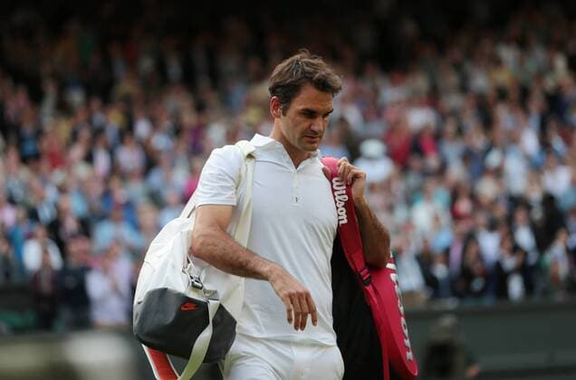 Roger Federer leaves Center Court after beign deafeated by Sergiy Sakhovsky on day three of the 2013 Wimbledon Championships in London on June 26, 2013.  LON2013062625