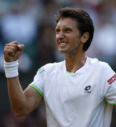 Sergiy Stakhovsky of Ukraine celebrates after the second round of the men s singles on day 3 of the Wimbledon Lawn Tennis Championships at the All England Lawn Tennis and Croquet Club in London, Britain, on June 26, 2013. (Xinhua Wang Lili) (SP)BRITAIN-LONDON-TENNIS-WIMBLEDON-DAY 3 