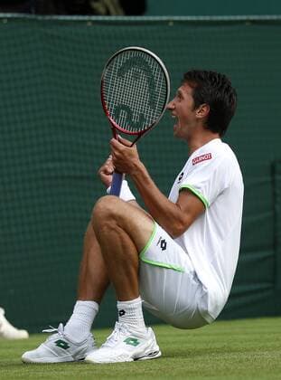 Sergiy Stakhovsky of Ukraine celebrates after the second round of the men s singles on day 3 of the Wimbledon Lawn Tennis Championships at the All England Lawn Tennis and Croquet Club in London, Britain, on June 26, 2013. (Xinhua Wang Lili) (SP)BRITAIN-LONDON-TENNIS-WIMBLEDON-DAY 3 