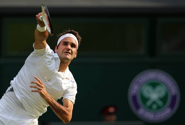 Roger Federer of Switzerland competes during the second round of men s singles on day 3 of the Wimbledon Lawn Tennis Championships at the All England Lawn Tennis and Croquet Club in London, Britain, on June 26, 2013. (Xinhua Yin Gang) (SP)BRITAIN-LONDON-TENNIS-WIMBLEDON-DAY 3 