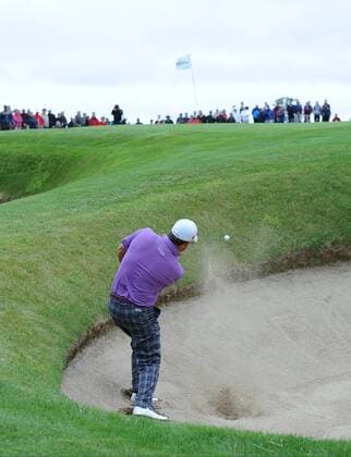 27.06.2013 Maynooth, Ireland. Graeme McDowell chips out of the bunker on the 4th hole during the second round of the Irish Open from Carton House Golf Club xTommyxGrealyx  ActionPlus00000127771