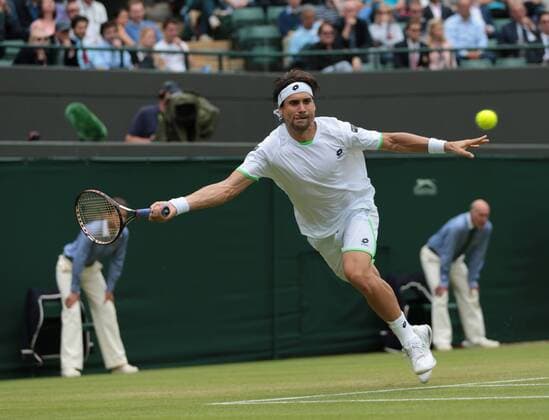 Spain s David Ferrer runs for the ball in his on day five of the 2013 Wimbledon Championships in London on June 28, 2013.  LON2013062822