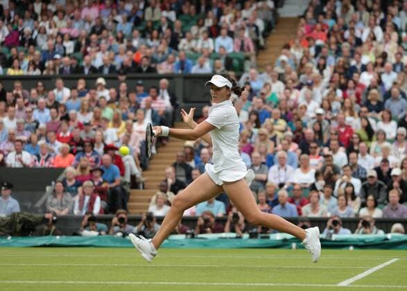 England s Laura Robson returns in her match on day five of the 2013 Wimbledon Championships in London on June 28, 2013.  LON2013062824