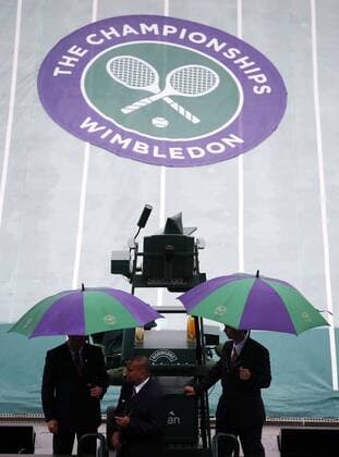 LONDON, June 28, 2013 - Covers are seen to protect the grass on courts from being rained on day 5 of the Wimbledon Lawn Tennis Championships at the All England Lawn Tennis and Croquet Club in London, Britain, on June 28, 2013. (Xinhua Wang Lili) BRITAIN-LONDON-TENNIS-WIMBLEDON-DAY 5 