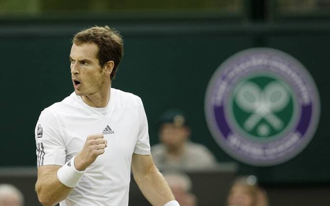 Andy Murray of Great Britain celebrates during the third round of men s singles on day 5 of the Wimbledon Lawn Tennis Championships at the All England Lawn Tennis and Croquet Club in London, Britain, on June 28, 2013. (Xinhua Yin Gang) BRITAIN-LONDON-TENNIS-WIMBLEDON-DAY 5 