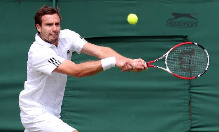 29.06.2013. Wimbledon, London, England. Day Six of the The Wimbledon Tennis Championships 2013 held at The All England Lawn Tennis and Croquet Club, London, England, UK. Emests Gulbis (LAT) xKieranxGalvinx  ActionPlus11424204