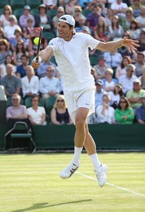 Wimbledon Championships 2013, AELTC,London, ITF Grand Slam Tennis Tournament, Tommy Haas (GER) springt hoch und spielt einen Volley,Aktion,Einzelbild Ganzkoerper,Hochformat,