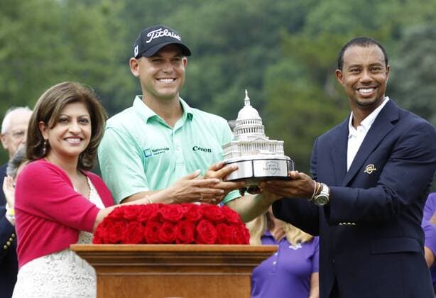 Bill Haas poses with Tiger Woods and Kay Kapoor, head of AT&T Government Solutions, after Haas won the AT&T National at Congressional Country Club on June 30, 2013 in Bethesda, Maryland.  WAP20130630835