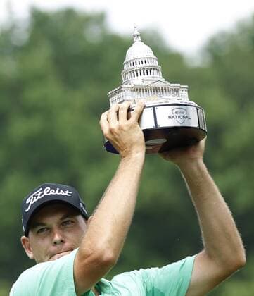 Bill Haas holds up his trophy after winning the AT&T National at Congressional Country Club on June 30, 2013 in Bethesda, Maryland.  WAP20130630838