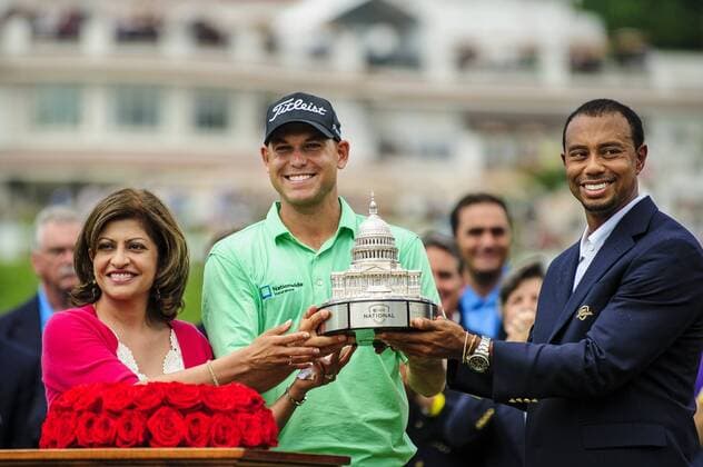 June 30, 2013 - Bethesda, MD, USA - Kay Kapoor, president of AT&T government services, and tournmant host Tiger Woods present Bill Haas with the trophy during the AT&T National at Congressional Country Club in Bethesda, Maryland, Sunday, June 30, 2013. AT&T National - ZUMAm67