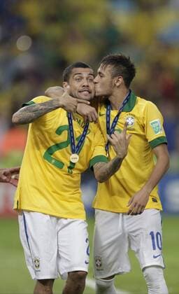 Brazil s Dani Alves (L) and Neymar celebrate during the awarding ceremony after the final of the FIFA s Confederations Cup Brazil 2013 against Spain in Rio de Janeiro, Brazil, on June 30, 2013. Brazil won 3-0 and claimed the title. (Xinhua Guillermo Arias) (itm) (SP)BRAZIL-RIO DE JANEIRO-CONFEDERATIONS-BRAZIL VS SPAIN-FINAL 