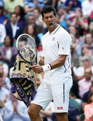 Novak Djokovic of Serbia celebrates during the fourth round of men s singles on day 7 of the Wimbledon Lawn Tennis Championships at the All England Lawn Tennis and Croquet Club in London, Britain on July 1, 2013. (Xinhua Wang Lili) (SP)BRITAIN-LONDON-TENNIS-WIMBLEDON-DAY 7 