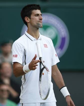 Novak Djokovic of Serbia reacts during the fourth round of men s singles on day 7 of the Wimbledon Lawn Tennis Championships at the All England Lawn Tennis and Croquet Club in London, Britain on July 1, 2013. (Xinhua Wang Lili) (SP)BRITAIN-LONDON-TENNIS-WIMBLEDON-DAY 7 