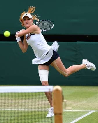 LONDON, July 2, 2013 -- Agnieszka Radwanska of Poland returns the ball during the quarterfinal of women s singles on day 8 of the Wimbledon Lawn Tennis Championships at the All England Lawn Tennis and Croquet Club in London, Britain on July 2, 2013. 
