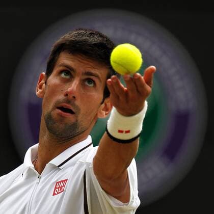 (130703) -- LONDON, July 3, 2013 (Xinhua) -- Novak Djokovic of Serbia serves during the quarterfinal of men s singles on day 9 of the Wimbledon Lawn Tennis Championships at the All England Lawn Tennis and Croquet Club in London, Britain, on July 3, 2013. (Xinhua Yin Gang) (jyc) (SP)BRITAIN-LONDON-TENNIS-WIMBLEDON-DAY 9 
