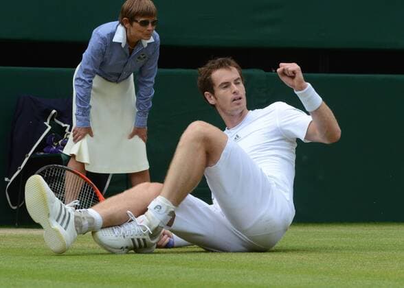 Tennis - 2013 Wimbledon Championships - Mens 1 4 Final Andy Murray celebrates his point after sliping on the grass 