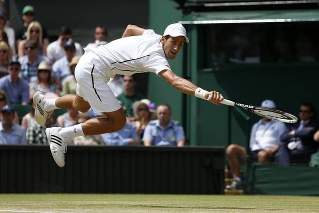(130705) -- LONDON, July 5, 2013 (Xinhua) -- Novak Djokovic of Serbia competes during the semifinal of gentlemen s singles on day 11 of the Wimbledon Lawn Tennis Championships at the All England Lawn Tennis and Croquet Club in London, Britain on July 5, 2013. (Xinhua Wang Lili) (SP)BRITAIN-LONDON-TENNIS-WIMBLEDON-DAY 11 
