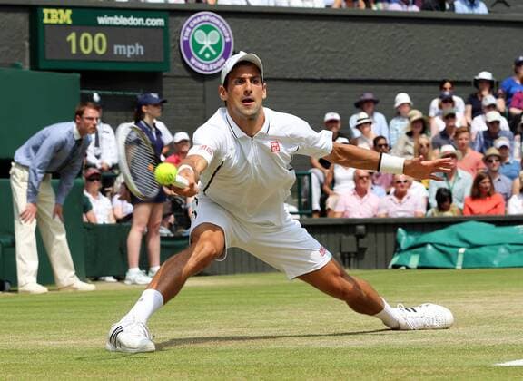 Novak Djokovic in action in his semi-final match at the Wimbledon Tennis Championships in London, Friday, 5th July 2013 StephenxLockx xi-Images  IIM-0185-0046
