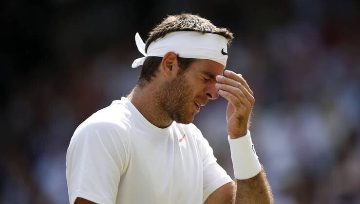 Juan Martin Del Potro of Argentina reacts during the semifinal of gentlemen s singles on day 11 of the Wimbledon Lawn Tennis Championships at the All England Lawn Tennis and Croquet Club in London, Britain on July 5, 2013. (Xinhua Wang Lili) (SP)BRITAIN-LONDON-TENNIS-WIMBLEDON-DAY 11 