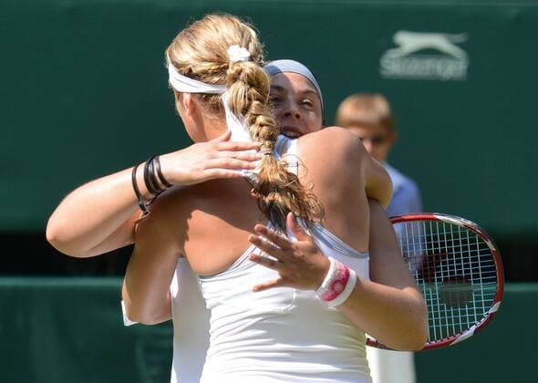 Tennis - 2013 Wimbledon Championships - Womens Final Marion Bartoli hugs Sabine Lisicki after winning the final 