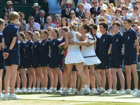 Tennis - 2013 Wimbledon Championships - Womens Final Marion Bartoli and Sabine Lisicki leave Centre Court arm in arm through the arenue of Ball boys and Ball girls 