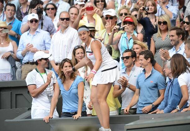 Tennis - 2013 Wimbledon Championships - Womens Final Marion Bartoli climbs up into the stand to family and coaches 