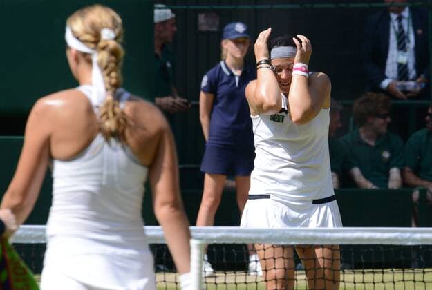 Tennis - 2013 Wimbledon Championships - Womens Final Marion Bartoli holds her hands to her head after winning the final 