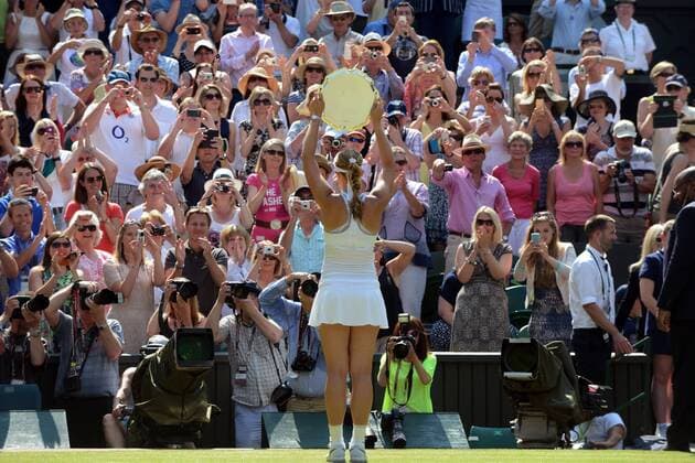 Tennis - 2013 Wimbledon Championships - Womens Final Sabine Lisicki shows off her Runners up Plate to the crowd 