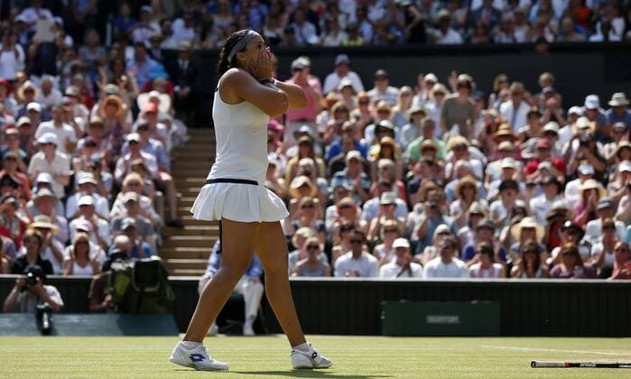 (130706) -- LONDON, July 6, 2013 (Xinhua) -- Marion Bartoli of France celebrates after her final of women s singles on day 12 of the Wimbledon Lawn Tennis Championships at the All England Lawn Tennis and Croquet Club in London, Britain, on July 6, 2013. 