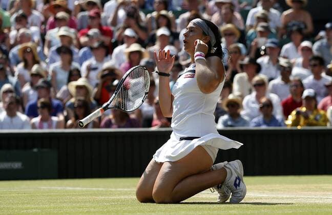 (130706) -- LONDON, July 6, 2013 (Xinhua) -- Marion Bartoli of France celebrates after her final of women s singles on day 12 of the Wimbledon Lawn Tennis Championships at the All England Lawn Tennis and Croquet Club in London, Britain, on July 6, 2013. 