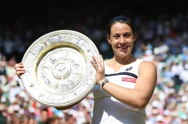 Marion Bartoli holds the winners trophy in the Women s Final of the 2013 Wimbledon Championships in London on July 6, 2013.  LON2013070611