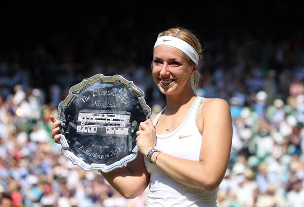 Sabine Lisicki holds the second place trophy in the Women s Final of the 2013 Wimbledon Championships in London on July 6, 2013.  LON2013070699