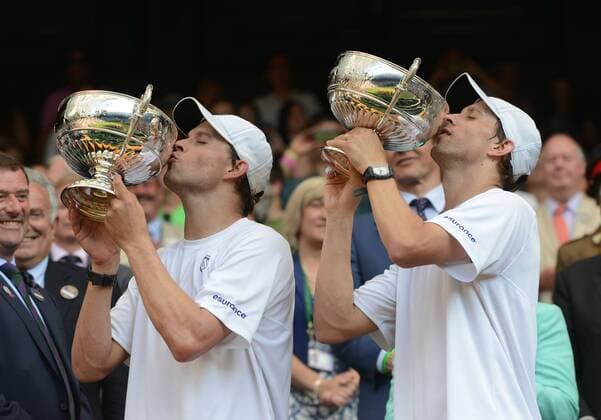 Tennis - 2013 Wimbledon Championships - Mens Doubles Final Centre Court Bob Bryan and Mike Bryan - USA kiss their trophies 