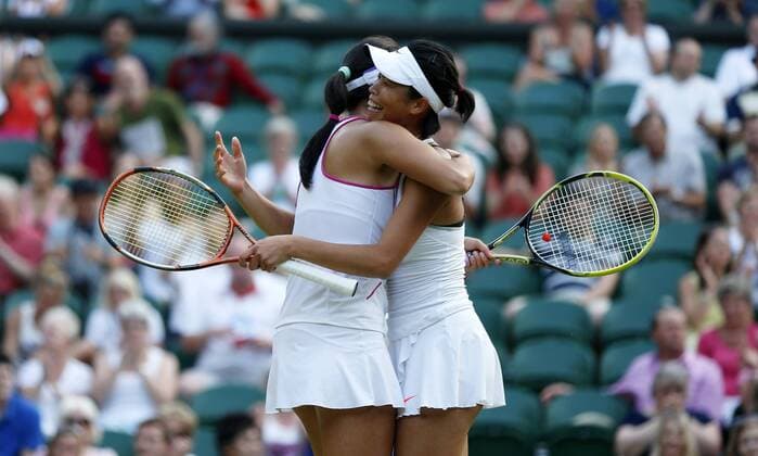 Peng Shuai(L) of China and Su-Wei Hsieh of Chinese Taipei celebrate after the final of women s doubles on day 12 of the Wimbledon Lawn Tennis Championships at the All England Lawn Tennis and Croquet Club in London, Britain on July 6, 2013. (Xinhua Wang Lili) (SP)BRITAIN-LONDON-TENNIS-WIMBLEDON-DAY 12-WOMEN S DOUBLES FINAL 