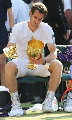 The lid of the trophy drops to the ground after Andy Murray wins the Men s Final at the Wimbledon Tennis Championships in London, Sunday, 7th July 2013  IIM-0194-0050