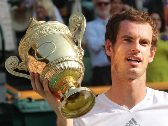 Andy Murray with the trophy after winning the Men s Final at the Wimbledon Tennis Championships in London, Sunday, 7th July 2013  IIM-0194-0057