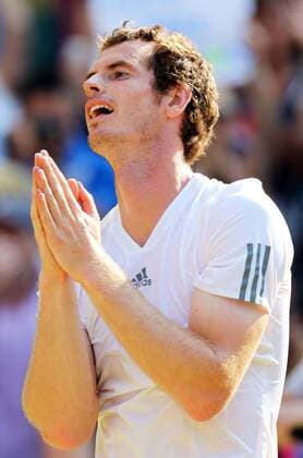 Andy Murray celebrates after winning the Men s Final at the Wimbledon Tennis Championships in London, Sunday, 7th July 2013  IIM-0194-0061