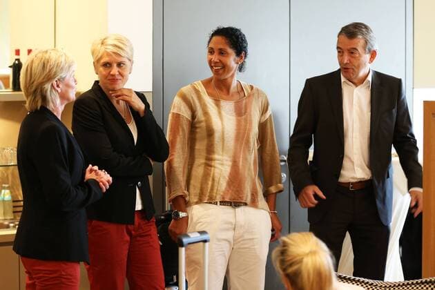 FRANKFURT AM MAIN, GERMANY - JULY 07: (L-R) Head coach Silvia Neid, Manager Doris Fitschen, Steffi Jones and DFB President Wolfgang Niersbach attend the Germany women s national team departure to Sweden at Frankfurt Airport on July 7, 2013 in Frankfurt am Main, Germany. Local Caption Doris Fitschen; Silvia Neid; Steffi Jones; Wolfgang Niersbach