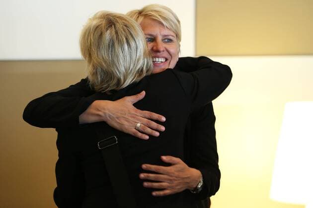 FRANKFURT AM MAIN, GERMANY - JULY 07: Head coach Silvia Neid (L) hugs Manager Doris Fitschen (R) during the Germany women s national team departure to Sweden at Frankfurt Airport on July 7, 2013 in Frankfurt am Main, Germany. Local Caption Silvia Neid; Doris Fitschen
