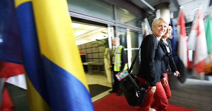 FRANKFURT AM MAIN, GERMANY - JULY 07: Manager Doris Fitschen (L) and Nadine Angerer (R) pass a flag of Sweden during the Germany women s national team departure to Sweden at Frankfurt Airport on July 7, 2013 in Frankfurt am Main, Germany.Local Caption Doris Fitschen; Nadine Angerer