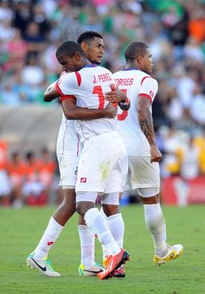 07 July 2013: Midfielder Anibal Godoy (20) of Panama hugs Midfielder Juan De Dios Perez (14) of Panama to celebrate the victory during the CONCACAF Gold Cup soccer match between Mexico v Panama at the Rose Bowl in Pasadena, CA. SOCCER: JUL 07 CONCACAF Gold Cup - Mexico v Panama Icon0071307072440 EDITORIAL USE ONLY