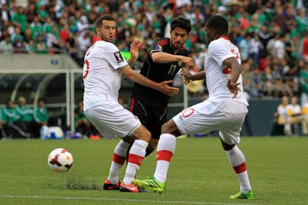 SEATTLE, July 11, 2013 - Mexico s Rafael Marquez Lugo (C) vies with Canada s David Edgar (L) and Doneil Henry during the Gold Cup 2013 match between Mexico and Canada in Seattle, the United States, on July 11, 2013. (Xinhua Alfredo Lopez Jam Media) (itm) (sp) (SP)US-SEATTLE-SOCCER-GOLD CUP-MEXICO VS CANADA 