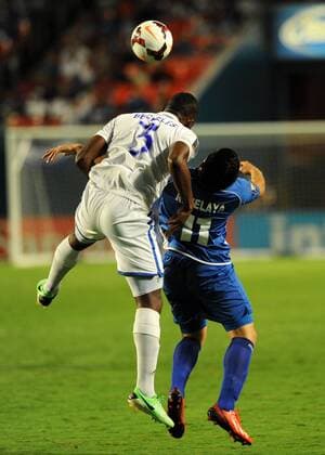 July 12, 2013: Honduras Brayan Beckeles (3) and Salvador Rodolfo Zelaya Garcia (11) jump for the ball during the Honduras v Salvador in the CONCACAF Gold Cup Game at Sun Life Stadium in Miami Gardens, Florida. SOCCER: JUL 12 CONCACAF Gold Cup - Honduras v El Salvador Icon130712010 EDITORIAL USE ONLY