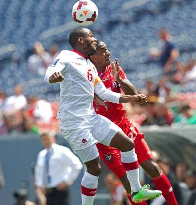 July 14, 2013 - Commerce City, Colorado, U.S - Panama s RICHARD DIXON, right, goes up for a head ball Canada s JULIAN DE GUZMAN, left, during the 1st. half at Sports Authority Field at Mile High Sunday afternoon. Panama and Canada draw to 0-0. Soccer 2013- CONCACAF Gold Cup - Panama and Canada draw to 0-0. - ZUMAav4