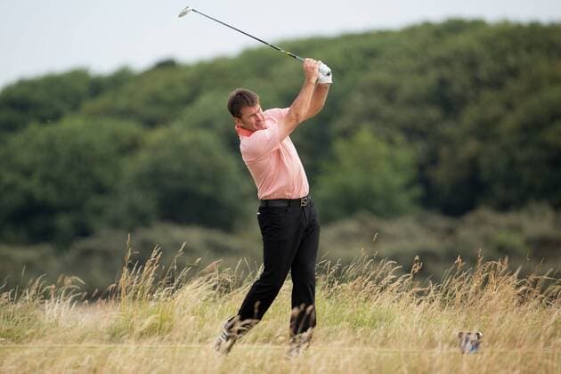 Golf - 2013 Open Championship at Muirfield - Thursday Round One Sir Nick Faldo tees off on the 6th 