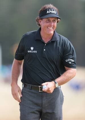USA s Phil Mickelson smiles on the 8th hole on the first day of the 2013 Open Championship in Muirfield, Scotland on July 18 , 2013.  LON2013071817